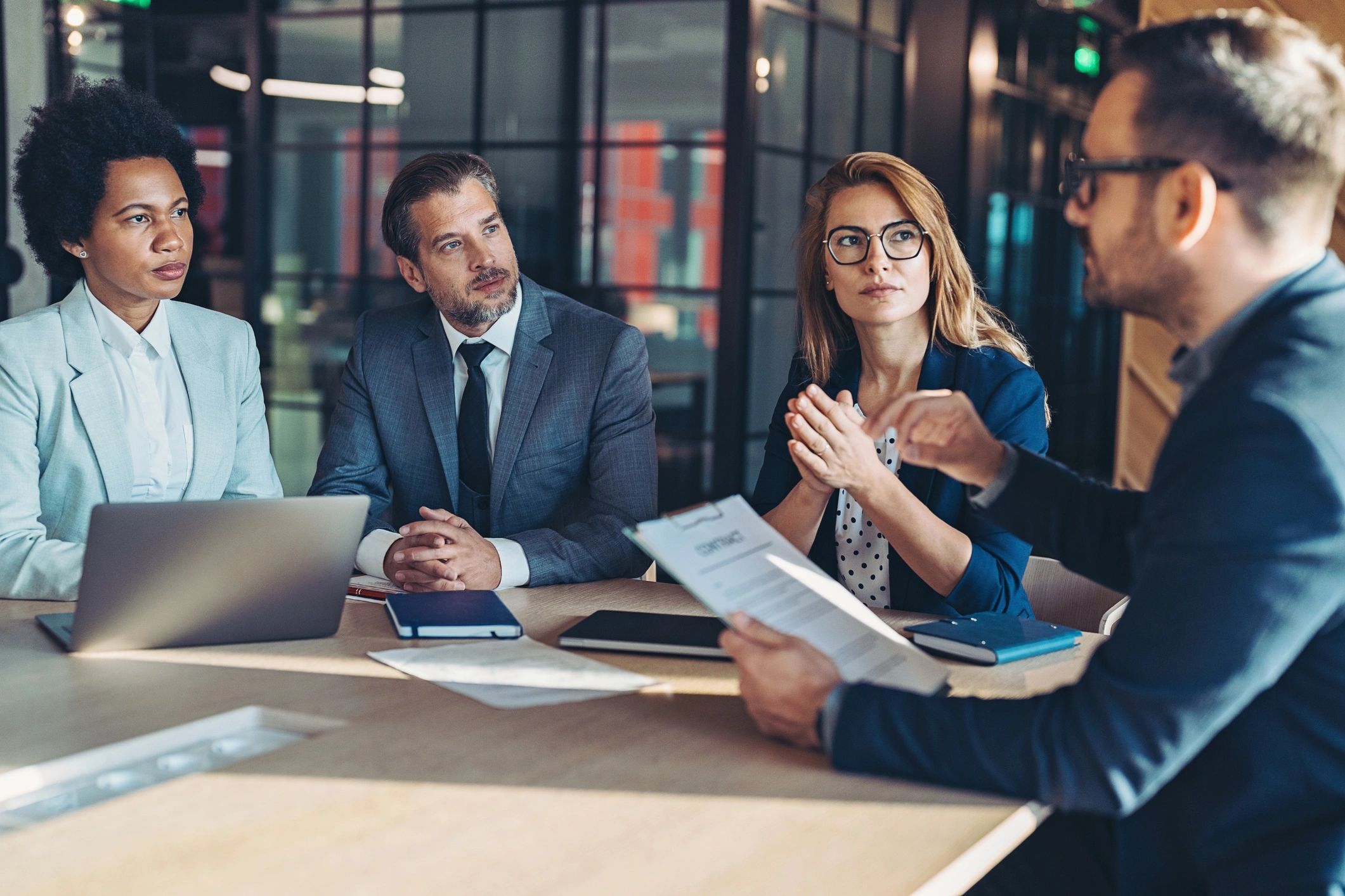 Professional leading a collaborative office discussion